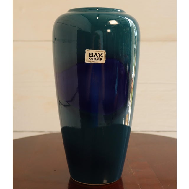A splendid vase, typical of West German production from the 1970s. In beautiful blue and teal, it features a round base,...