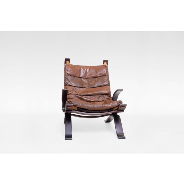 Original Focus sling lounge chair, designed in 1970s and manufactured by Bramin Møbler in Denmark. Bent plywood frame is...