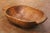 This authentic antique French dough bowl, hand-carved from a single solid block of elm circa 1880, exemplifies the...