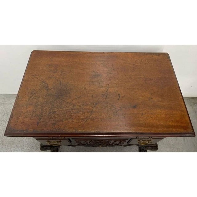 A finely crafted Chippendale Revival lowboy by renowned American furniture maker Councill Craftsmen, showcasing the...