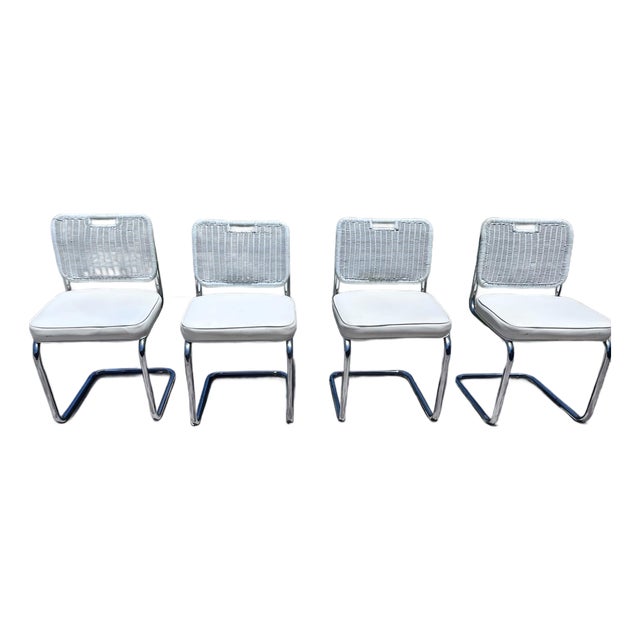 Vintage Set of Four Chrome Cantilever Dining Chairs With White Woven Rattan Backs For Sale
