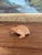 This hand-carved wooden frog sculpture features a charming, stylized form with deeply incised linear and chevron like...