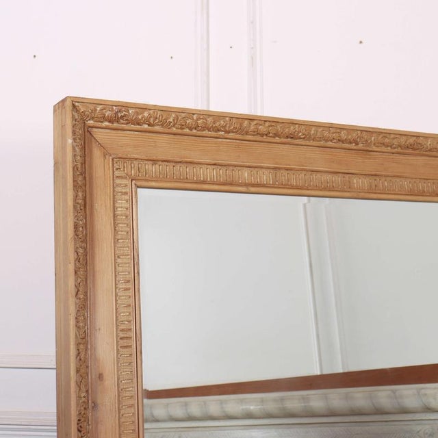Large 18th C carved pine mirror with latter plate. 1790 This piece is designed in the style of the selected designer...