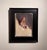 This oil painting captures a side profile of a figure with a strikingly modern hairstyle, showcasing a blend of softness...