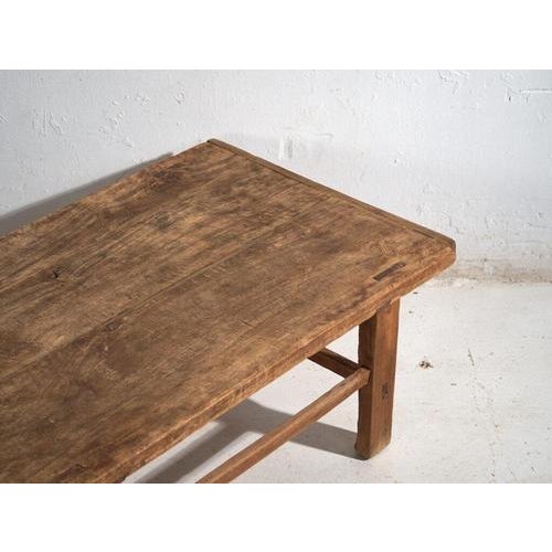 Antique low table in pine wood, traditional Chinese furniture originating from northern China and dated circa 1920....