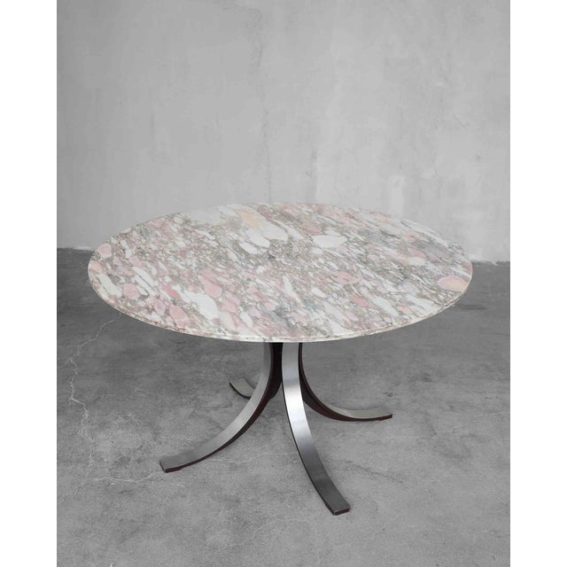 A rare round table model t69 with a carrara arabesque marble top, made by tecno designers osvaldo borsani & eugenio gerli....