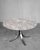 A rare round table model t69 with a carrara arabesque marble top, made by tecno designers osvaldo borsani & eugenio gerli....
