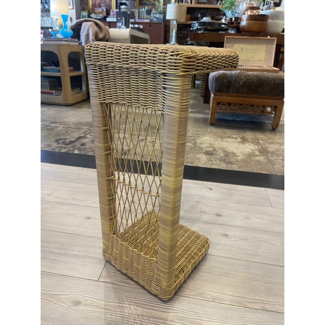 Elevate your indoor or outdoor living area with this charming wicker style drinks table. Made with faux wicker and a sleek...