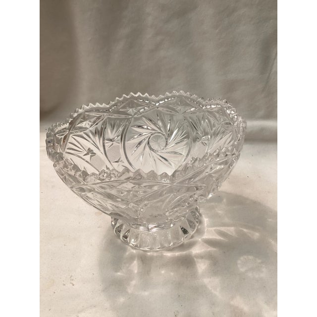 This bowl features a bold, starburst and diamond, cut pattern, accented with a scallop rim. The clear glass is heavy and...