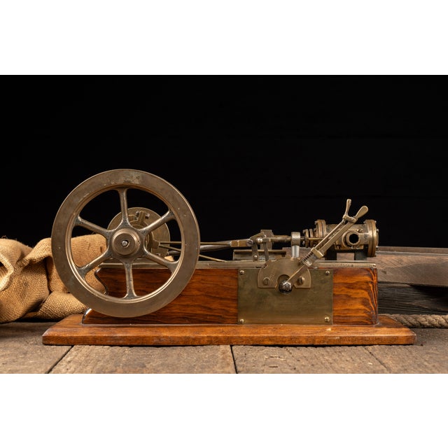 Brass steam engine valve gear demonstration model produced to illustrate the operation and timing of steam valve...
