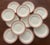 Large set of Coalport dinner plates with a pink edge with gold scalloped trim. The plates were made in England around...
