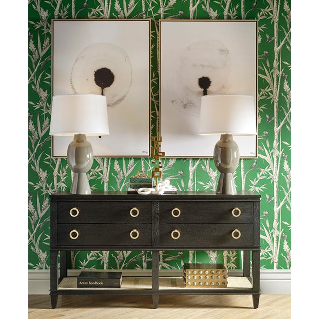 New special order item. Not vintage. The Richmond cerused oak console has four drawers, an open cane shelf, and brass...
