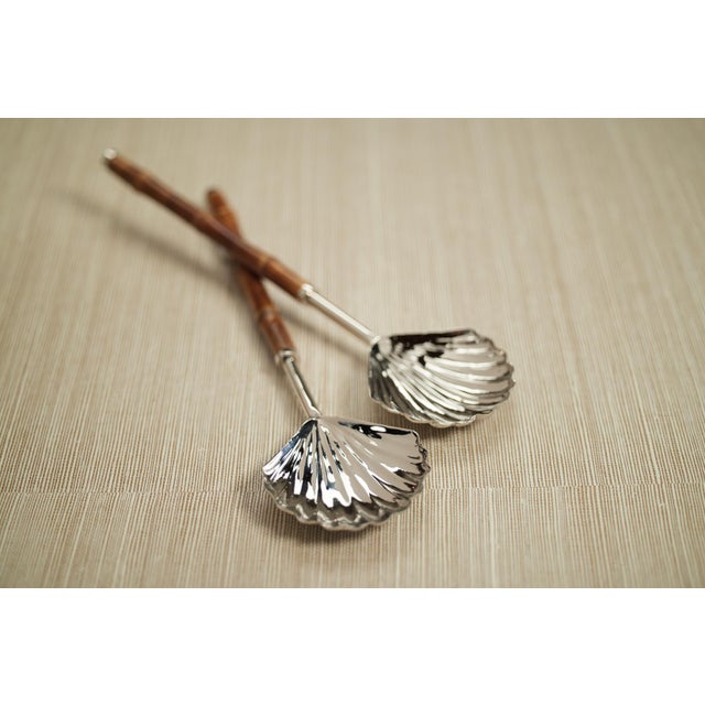 Bring undersea treasures to your table with our serving set. The lovely bamboo handles and the shell-inspired heads of...