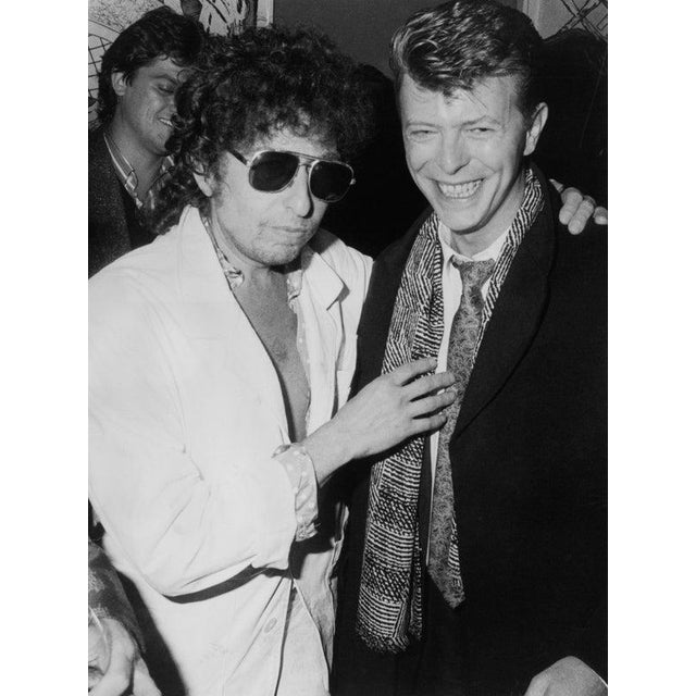 'Biograph' Release Party American singer-songwriter Bob Dylan and British singer-songwriter David Bowie (1947-2016) attend...