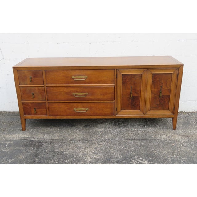 This high quality Dresser is made of wood, walnut, burlwood, and veneer. It was made by Fancher Furniture, and it is...
