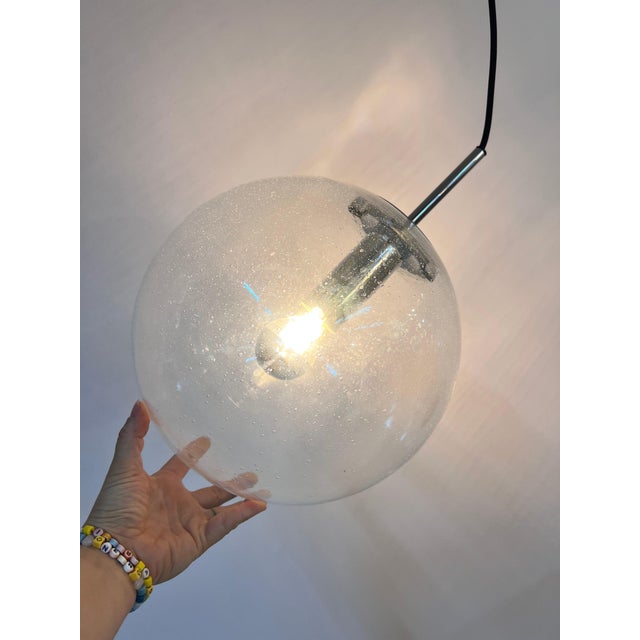 This large glass and chrome spherical lamp from the renowned Glashütte Limburg manufactory is a truly exceptional design...