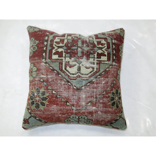 Pillow made from a 19th-century antique rug with cotton back. Zipper closure and foam insert provided. 16'' x 16''