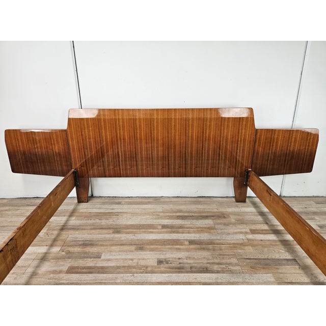 An elegant vintage double bed from the 1960s, paired with a matching chest of drawers, featuring a refined design and...