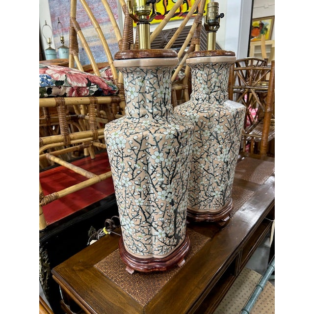 Beautiful large vintage pair of pink porcelain cherry blossom lamps to add a classic decorative touch to your space. Lamps...