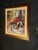 Framed print of "Cafe Berlotti" after the Canadian artist Brent Heighton: a sunlit Paris-style café corner with red...