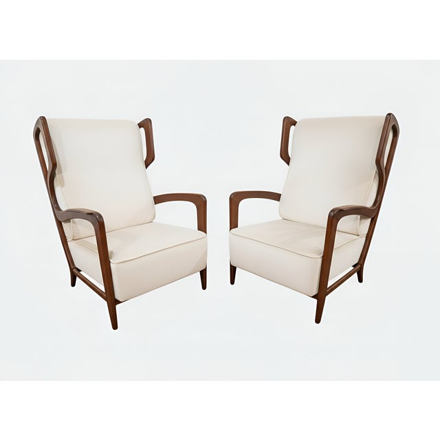 Breathtaking pair of rare Gio Ponti Lounge chairs with lacquered walnut frame and freshly upholstered in creamy performanc...