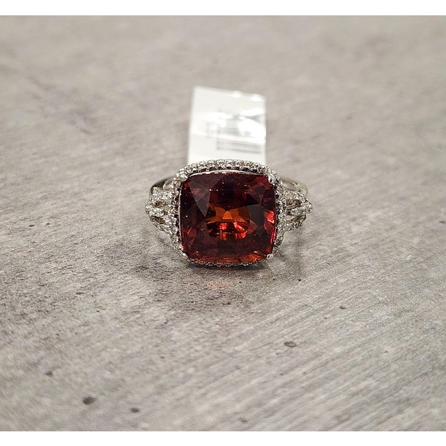 This beautiful garnet and diamond ring is a bold and captivating statement piece, crafted to showcase rich color and...
