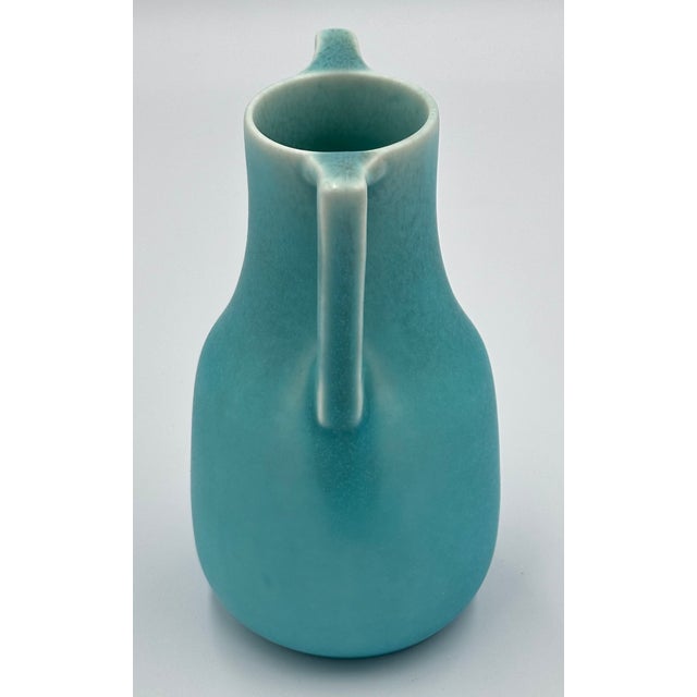 Discover the timeless charm of this exquisite antique Rookwood Art Pottery vase, a true treasure for any collector or home...