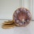 Adorable natural-toned seashell catchall basket, featuring an assortment of purple shells adorning the lid. Includes five...