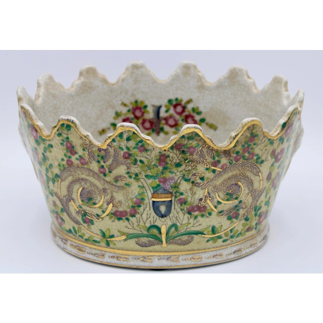 Fall in love with this vintage Chinoiserie cachepot planter. It is a stunning piece with golden gilt accents and colorful...