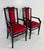 Refined pair of Italian armchairs distinguished by a strong yet elegant presence. The structure is crafted from black...