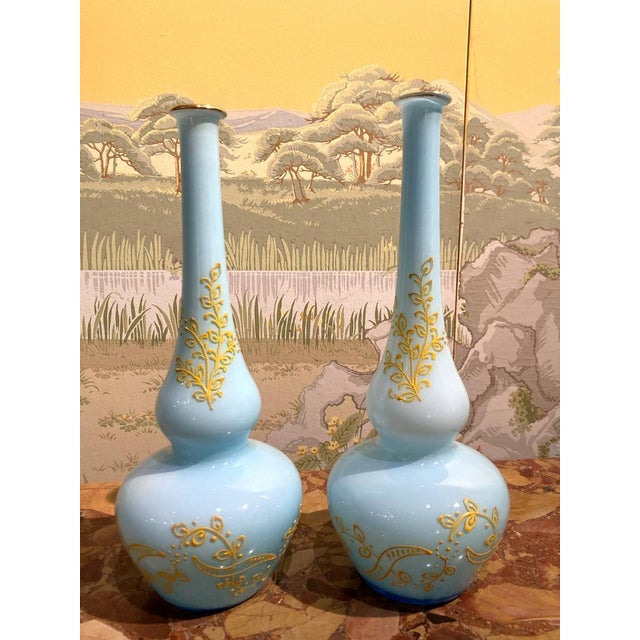 This pair of Italian Mid-Century Modern Murano opaline glass soliflower vases boast a funny trumpet and round belly shape,...