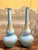 This pair of Italian Mid-Century Modern Murano opaline glass soliflower vases boast a funny trumpet and round belly shape,...