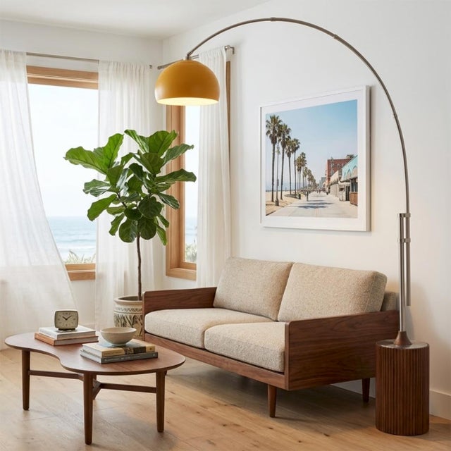 Featuring a dramatic blend of suspension and natural materials, the Tambo Arc Lamp is a Mid-Century Modern masterpiece...