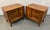 Add distinctive mid-century character to your bedroom with this exceptional pair of walnut and burl wood nightstands....