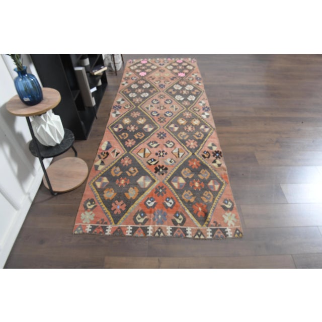 Vintage Turkish Hand-Knotted Kilim rug is a semi-antique vintage area rug. The '70s Eastern region of Anatolian's unique...