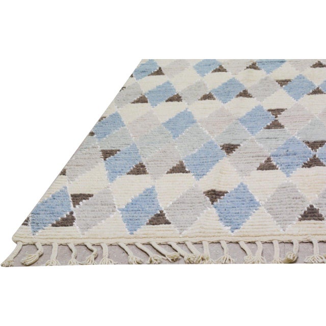 Hand-knotted with care using traditional rug-making techniques, this wool rug blends timeless craftsmanship with a modern...