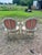 Pair of 19th Century Louis XVI Armchairs crafted with hand-carved and painted wood frames, featuring elegant oval backs,...