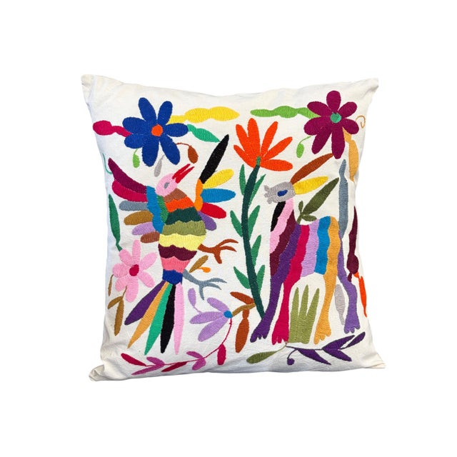 An exceptional example of Mexican Otomi embroidery textile pillow features meticulously hand-stitched imagery of deer,...