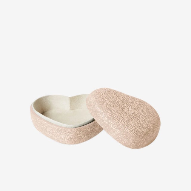 This pretty heart-shaped box is made of delicately embossed Faux Shagreen and is just the right size for essentials, from...