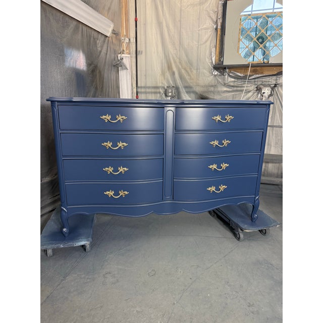 • Vintage French Provincial style • Professionally refinished in deep navy • Original hardware in gold tone • Smooth,...