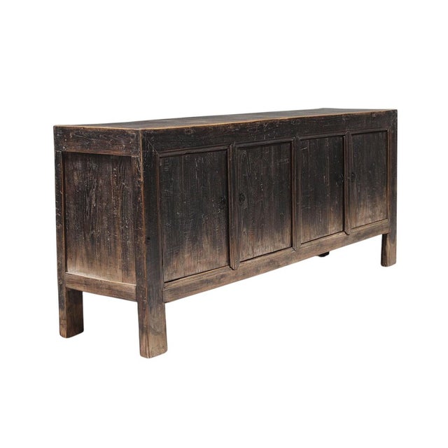 This vintage sideboard is made from reclaimed solid wood featuring a weathered, dark charcoal brown finish with rustic...