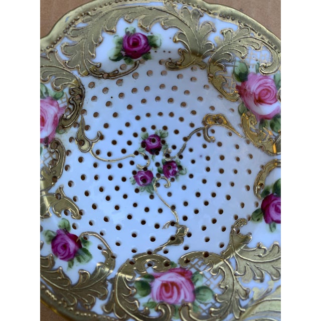 Very fine hand painted porcelain tea strainer, not marked, but could be Dresden or Budapest. Lots of gold work, raised...