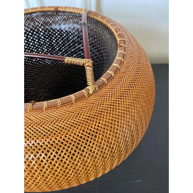 A beautiful bamboo sculpture in a double-walled basket form by contemporary Japanese bamboo artist Kawano Shoko (born...
