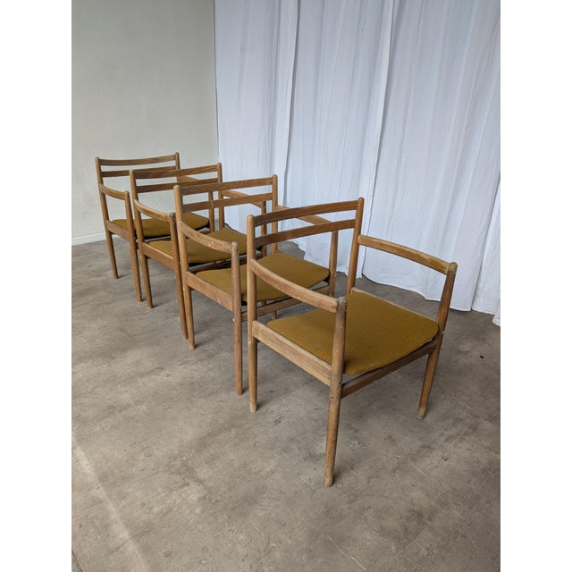 Set of 4 wooden dining armchairs manufactured by STOL Kamnik in former Yugoslavia around the 1960s–1970s. These vintage...