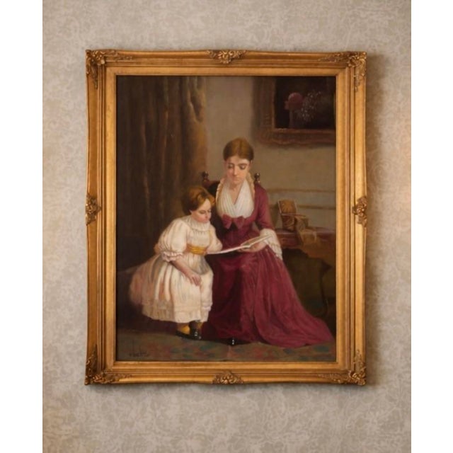 Vintage oil painting depicting a tender interior scene of a mother reading to a young child. The composition has a warm,...