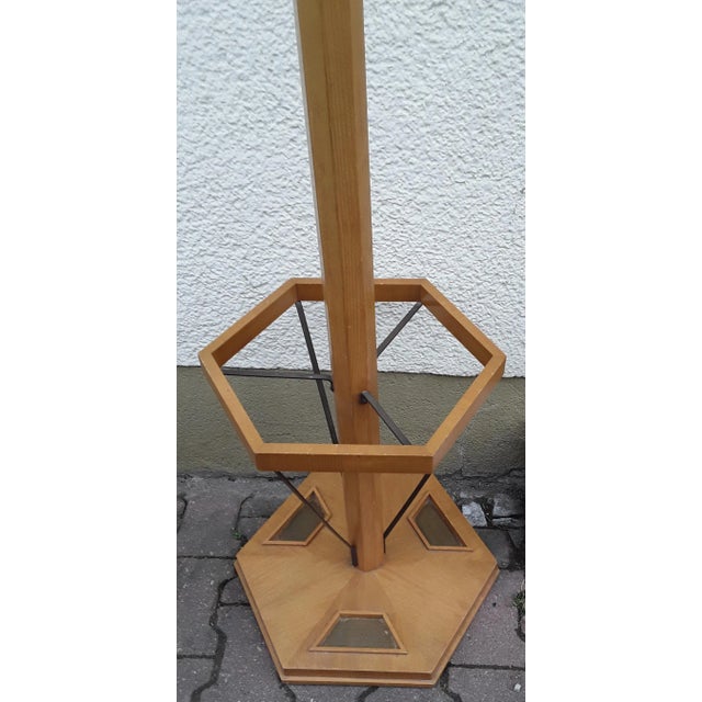 Freely adjustable vintage coat stand in yellow-brown ash with integrated umbrella stand and rotating carousel part with...