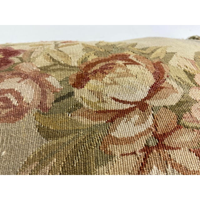 This is a vintage tasselled Aubusson tapestry floral pillow. This floral tapestry has beautiful tones of rose, soft green...