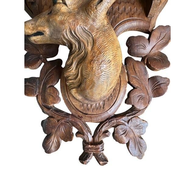 Black Forest deer shelf. Hand carved. Old repairs to plaque. Not noticeable from front of piece.