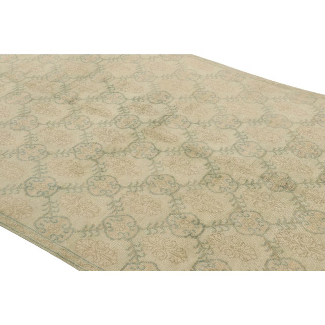 This vintage rug is a 6x10 Turkish distressed piece, made with hand-knotted wool circa mid-20th century. It is an exciting...