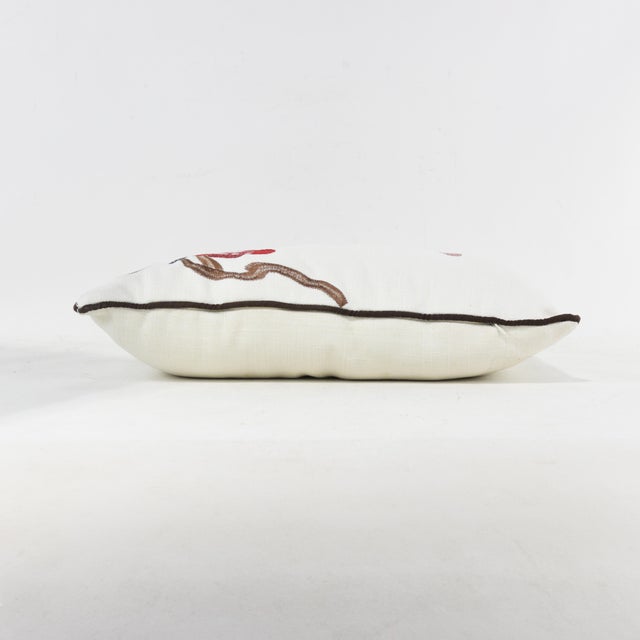 Add a delicate, nature-inspired touch to your decor with this embroidered pillow, featuring a whimsical bird perched on a...